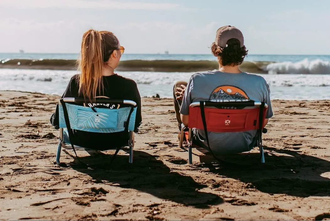 2 Pack of Neso Lightweight Water Resistant Beach Chairs with Shoulder Strap and Slip Pocket - Folds Thin (Aqua Fronds)